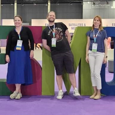 Three people at ESMO 2024